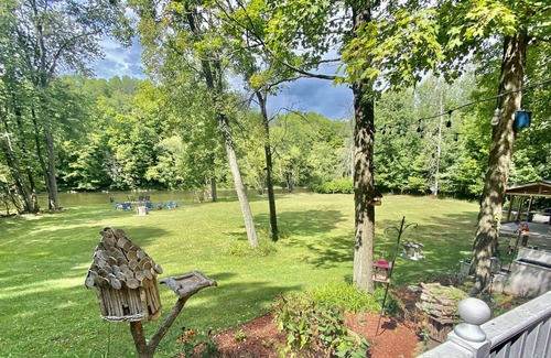 Paris House | Rustic large luxury home with 300 feet of riverfront surrounded by woods.