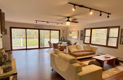 Paris House | Rustic large luxury home with 300 feet of riverfront surrounded by woods.