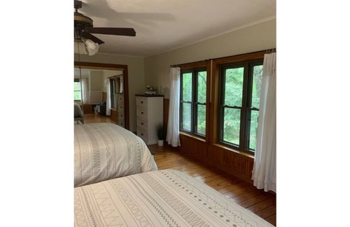 Blossom House | Rustic log cabin in 20 acres of woods.