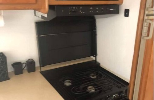 Kirby House | RV w/master bedroom, full bath & kitchen.