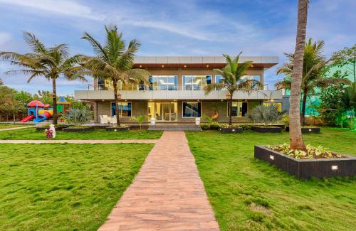 Bhiwandi Villa | SaffronStays Palm Paradise, Kalyan Khadavli - swimming pool with water slides, gazebo and indoor games