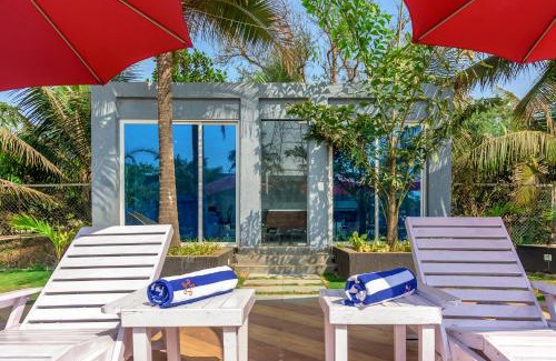 Bhiwandi Villa | SaffronStays Palm Paradise, Kalyan Khadavli - swimming pool with water slides, gazebo and indoor games