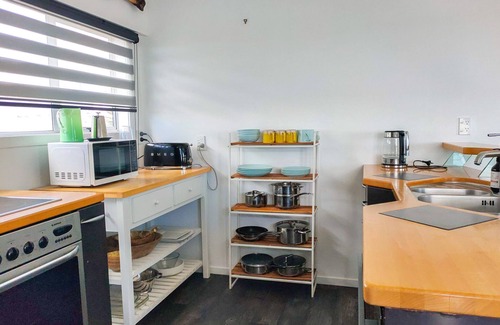 Pukehina House | "Salty Dog Beach Bach" is a comfortable and no-frills beachfront retreat.
