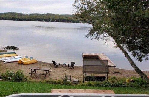 Amherst House | Sandy beach with spa and fire pit