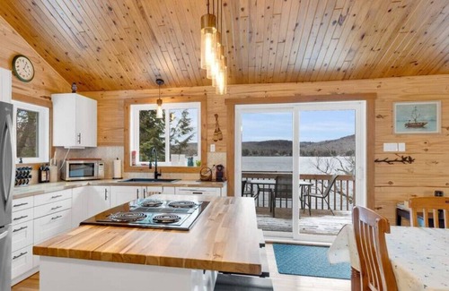 Amherst House | Sandy beach with spa and fire pit