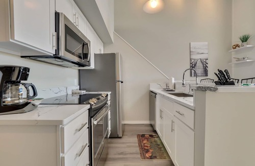 Charlevoix Condo | Scenic 2BR with Vaulted Ceilings | Downtown Charlevoix | Pool, Hot Tub, Sauna