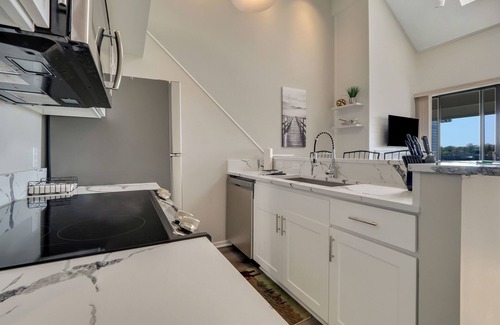 Charlevoix Condo | Scenic 2BR with Vaulted Ceilings | Downtown Charlevoix | Pool, Hot Tub, Sauna