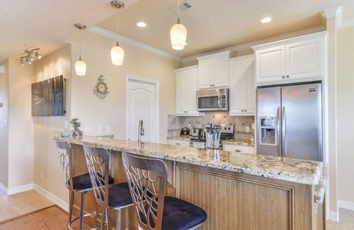 Pointe San Luis House | Sea Turtle Tango- Close to beach! Community Pool!