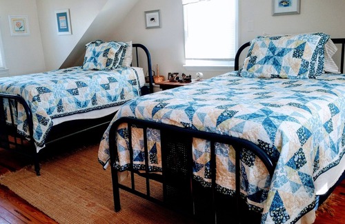Colonial Beach House | Seaside Serenity: Charming Cottage Steps from Sandy Beach & Downtown Delights