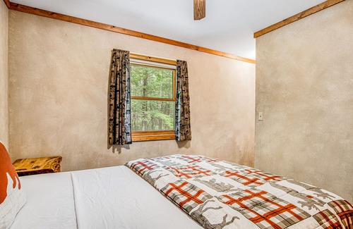 Lac du Flambeau House | Secluded dog-friendly home with dock, woodstove, porch, firepit, kayaks, & bikes