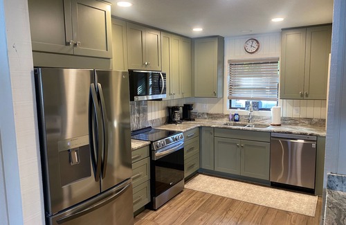 Clermont House | Secluded lake front w/private dock, boat lift, large screened porch