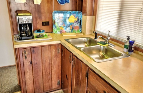 Stover House | Secluded Lake of the Ozarks Vacation Home Waterfront with a Covered Dock.
