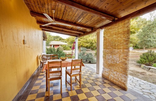 Vasilikos Cottage | Self catered cottage with large veranda and garden with hammock near the beach.