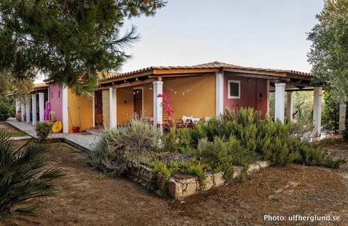 Vasilikos Cottage | Self catered cottage with large veranda and garden with hammock near the beach.