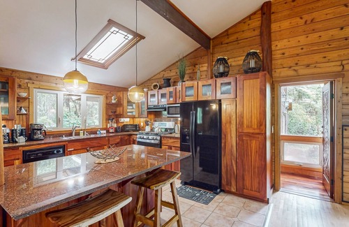 Volcano House | Serene 5-acre tropical hideaway with lanai and circular wood-burning fireplace