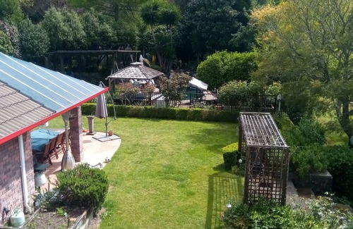 Tauriko House | Serenity @ Large Bedroom with Full Shared Bathroom with double bath.