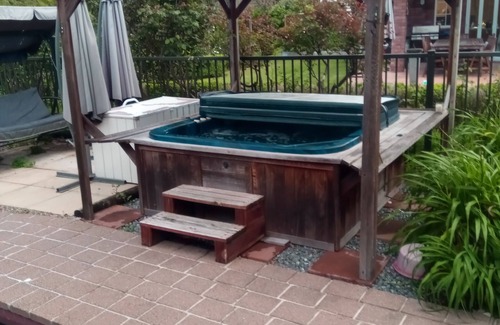 Tauriko House | Serenity @ Large Bedroom with Full Shared Bathroom with double bath.