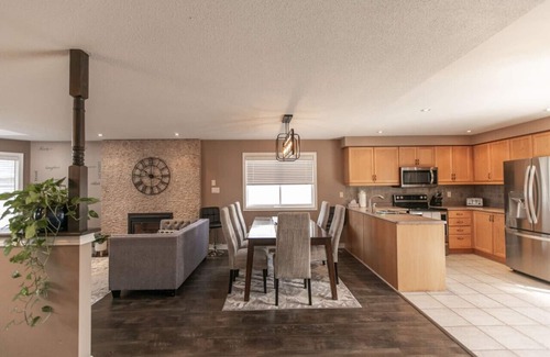Barrie House | Serenity & Style: 4BR w/Hot Tub, BBQ & Fire Table