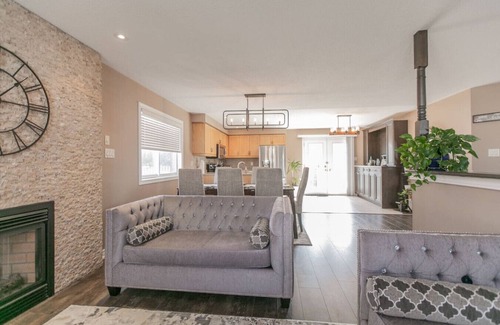 Barrie House | Serenity & Style: 4BR w/Hot Tub, BBQ & Fire Table