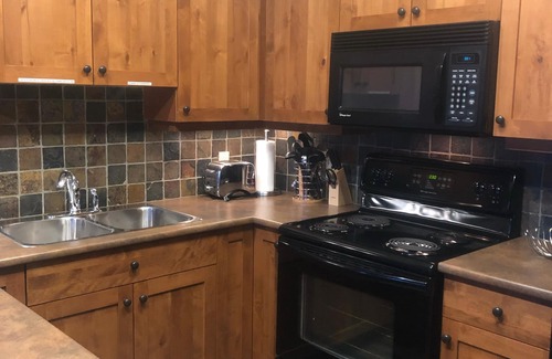 Sun Peaks Condo | Settler’s Crossing- 2 bdrm Ski In/Out, Private Hot Tub, BBQ and Heated Garage
