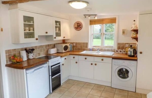 Freshwater Cottage | SHEEPWASH BARN, pet friendly, with a garden in Freshwater