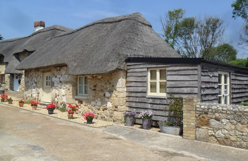 Freshwater Cottage | SHEEPWASH BARN, pet friendly, with a garden in Freshwater