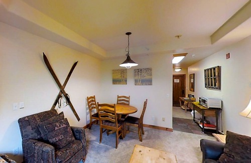 Four O'Clock Apartment | Ski-in/out studio condo with heated underground parking, hot tub & grill