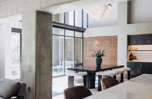 Uptown Condo | Sleek and Spacious Executive Loft with Full Bar, Theater Room, Fitness Room