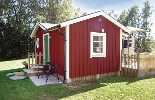 Sjotofta House | Small, well used cottage with terrace at the back.
