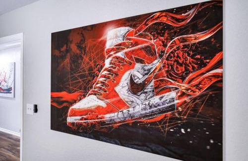 Eastside Promise Neighborhood House | Sneaker themed house near Downtown SA with 3 king beds