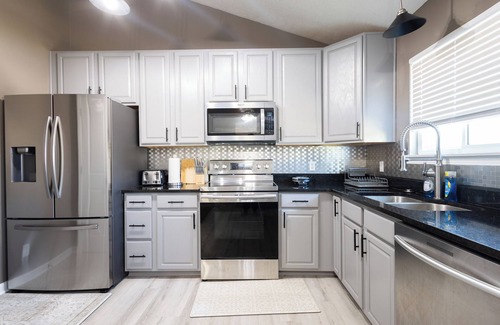 Chalco House | Spacious 4 bedroom house with AC, WiFi in, 2 living rooms, fenced, 2 car garage.