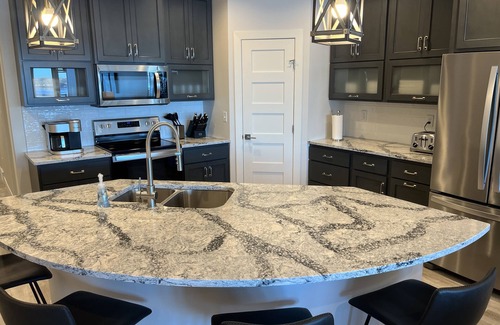 Arnolds Park Condo | Spacious 4 BedroomnLakefront Luxury. Panoramic Views & 6 waterpark passes at BB.
