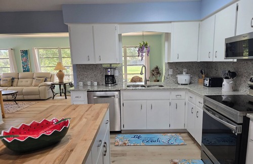 Oakland Hills House | Spacious 4-bedroom house in charming Rotonda West with WiFi, AC, canal front.