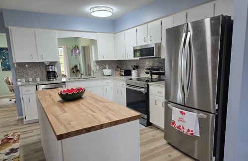 Oakland Hills House | Spacious 4-bedroom house in charming Rotonda West with WiFi, AC, canal front.