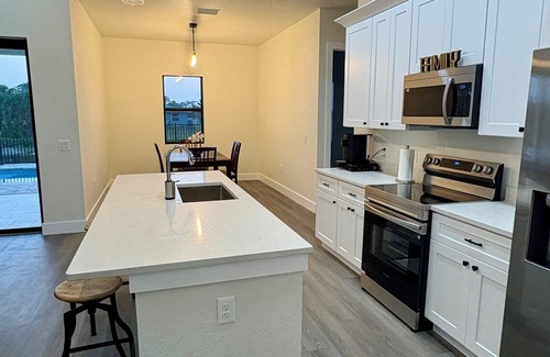 Oakland Hills House | Spacious 4-bedroom house with pool in peaceful Rotonda West near the beach.