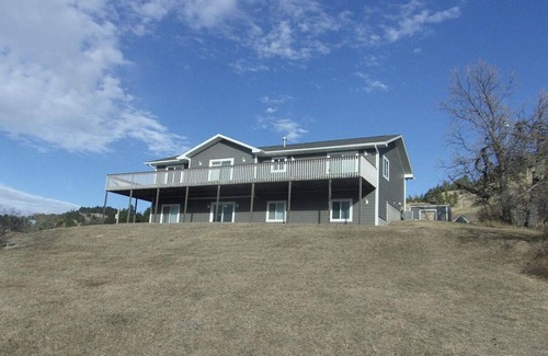 Sturgis House | Spacious 5-Bedroom Home Blocks away from Downtown nestled in Below STURGIS Sign