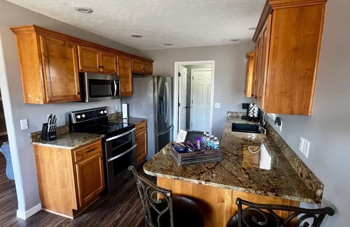 Battlefield House | Spacious 5-bedroom house with hot tub, firepit, movie room in quiet Battlefield