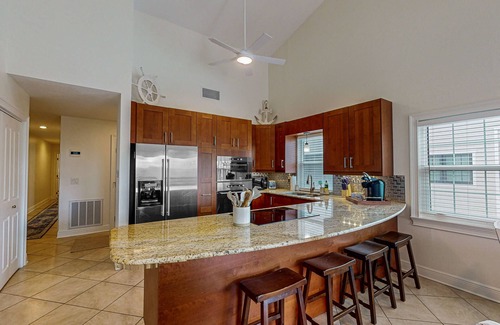Indian Shores Condo | Spacious and family friendly with pool, dock, and just steps to the beaches