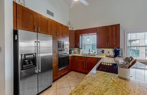 Indian Shores Condo | Spacious and family friendly with pool, dock, and just steps to the beaches