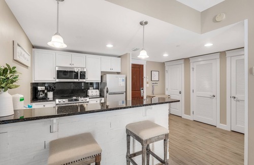 Baytowne Wharf Condo | Spacious Balcony ~ Spacious Living Area ~ Community Pool ~ Outdoor Seating