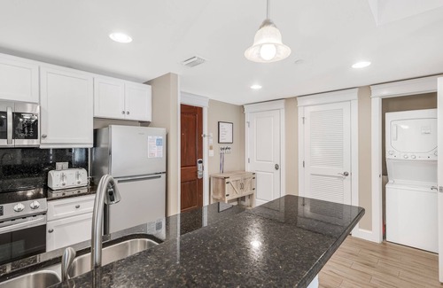Baytowne Wharf Condo | Spacious Balcony ~ Spacious Living Area ~ Community Pool ~ Outdoor Seating