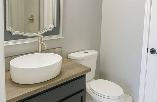 Braithwaite House | Spacious comfortable King room. Work-friendly. High-speed internet w/50" TVs