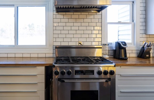 Quad Cities House | Spacious family home with luxe beds, fenced in back yard, heart of town!