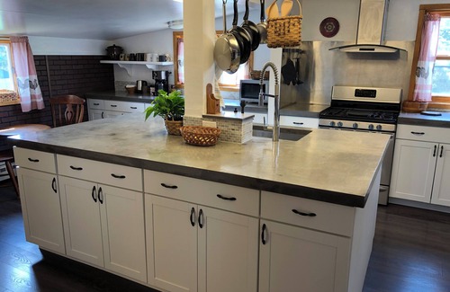 Calumet House | Spacious home with charming lodge feel – In town, one block from trails!
