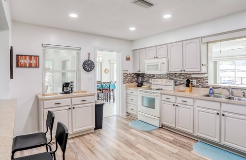 Highland House | Spacious home with water view, dock, lovely patio, central AC & washer/dryer