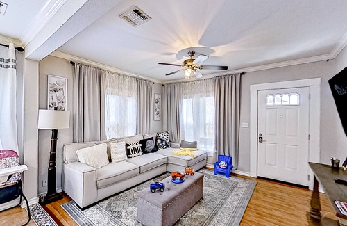 Midtown House | Spacious home with yard, deck, W/D, on-site parking & central AC