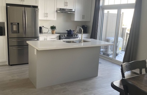 Cambridge House | Spacious luxurious townhouse with double car garage.