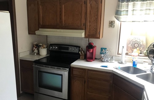 Tow House | Spacious open floor plan with beautiful oak trees.