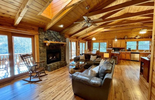 Lansing Cabin | Spacious Riverfront Log Cabin w/Hot Tub, Pet Friendly, Pool Table, Firepit