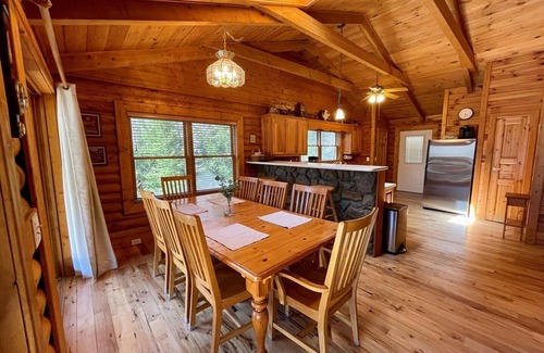 Lansing Cabin | Spacious Riverfront Log Cabin w/Hot Tub, Pet Friendly, Pool Table, Firepit